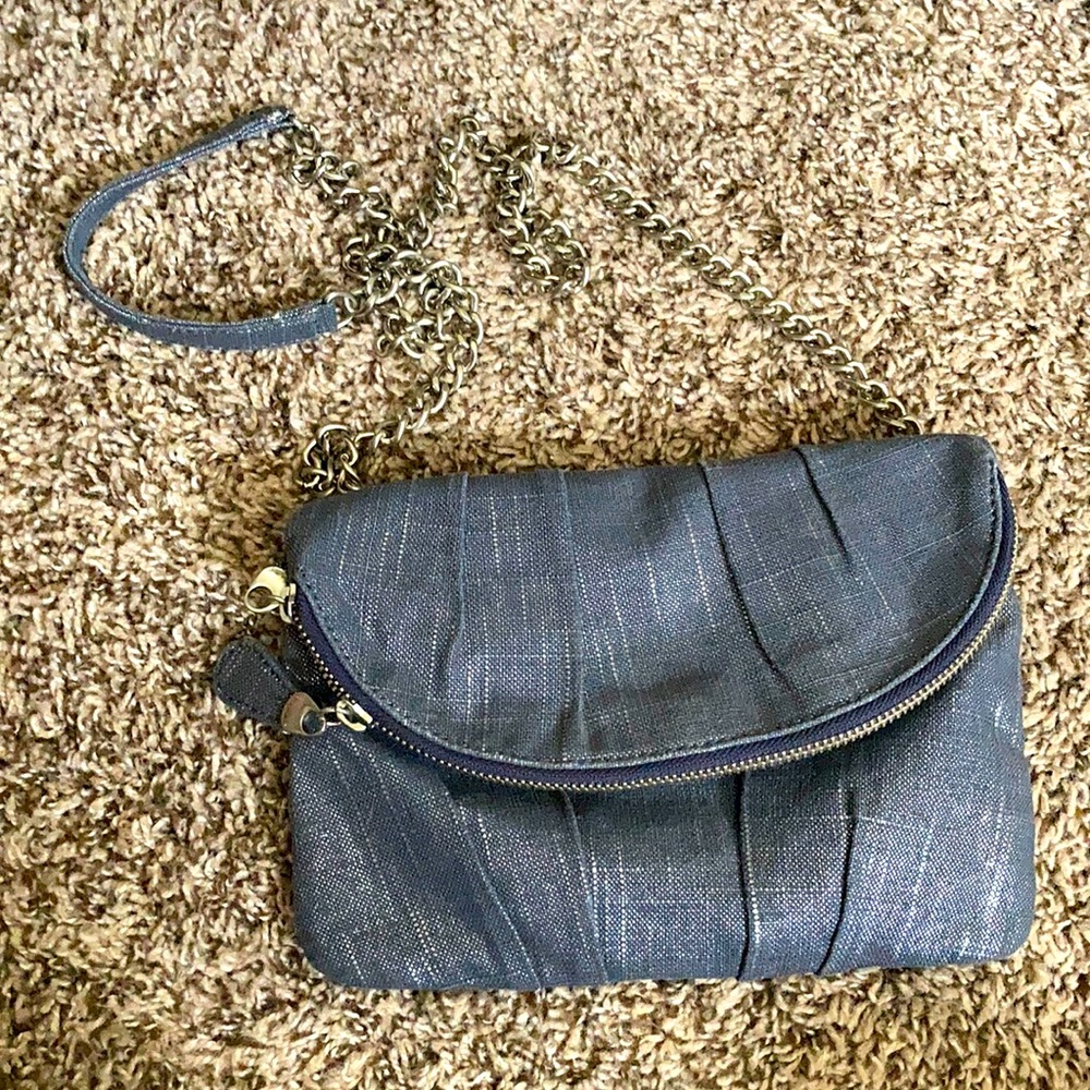 Fold over purse in silver denim pattern and hot pink lining